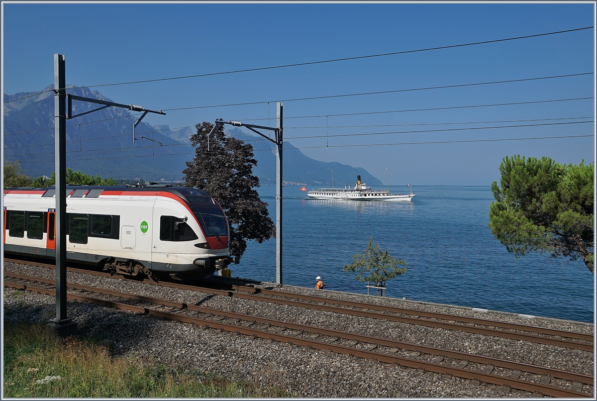 Der Flirt und ein Schiff - ein Versuch, Zug und Schiff auf einen Bild zu zeigen.

Bei Villeneuve, den 21. Aug. 2018