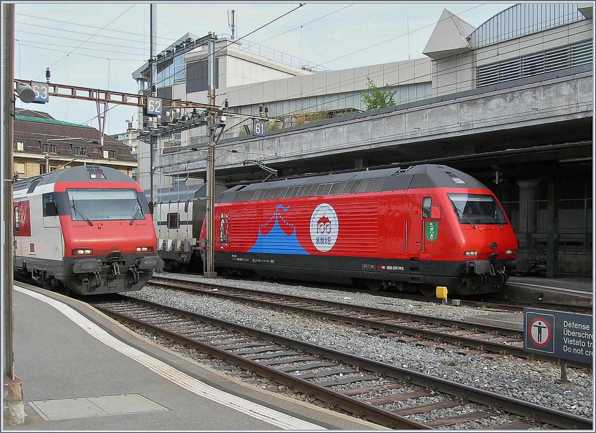 Die SBB Re 460 058-1  100 Jahre Zirkus Knie  wartet mit ihrem IC1 713 von Genève Aéroport nach St. Gallen in Lausanne auf die Abfahrt.

21. April 2019