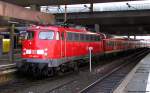110 449-6 schiebt den RE 11376 an diesem Nachmittag von Dsseldorf nach Kln Hbf. Mrz 2012