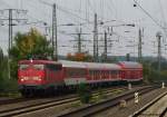 Mit dem Schadzug nach Dortmund passiert 115 383-2 den Hammer Personenbahnhof ber die Gleise der Gterumfahrung.