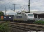 386 007 von Metrans mit einem G�terzug bei der durchfahrt in Delitzsch am 25.8.15