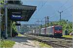 Die SBB Re 474 013 und eine weitere sind (bei kr�ftigem Gegenlicht) mit einem G�terzug Richtung Brig bei Varzo unterwegs.