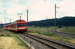 Im Sommer 1997 verl��t BDe 4/4 613 Le Noirmont in Richtung Glovelier, rechts geht es nach Tavannes
